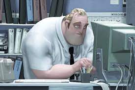 A tired man sitting at a computer